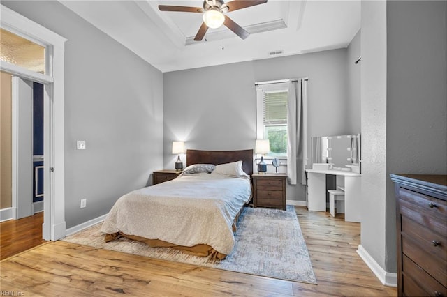 804 E Pembroke Ave, Hampton, VA 23669 - bedroom featuring a raised ceiling, wood finished floors, baseboards, and ceiling fan