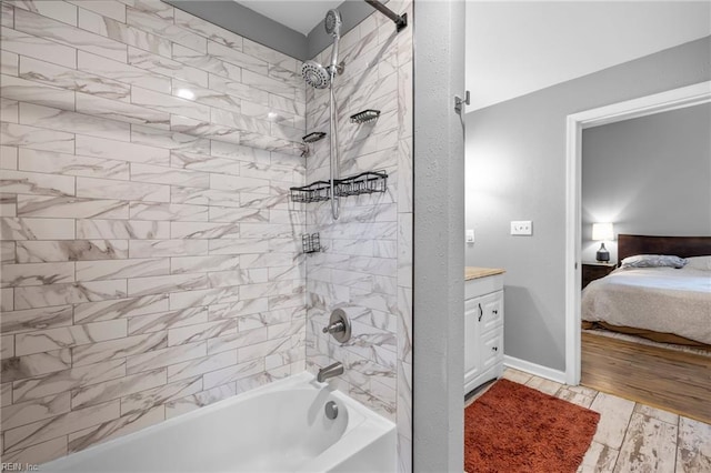 804 E Pembroke Ave, Hampton, VA 23669 - ensuite bathroom with shower / tub combination, vanity, and wood finished floors