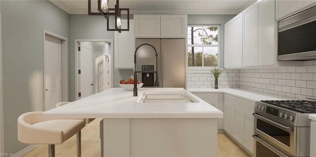 1548 Waltham Ln Unit A, Newport News, VA 23608 - kitchen featuring stainless steel appliances, ornamental molding, white cabinetry, an island with sink, and backsplash