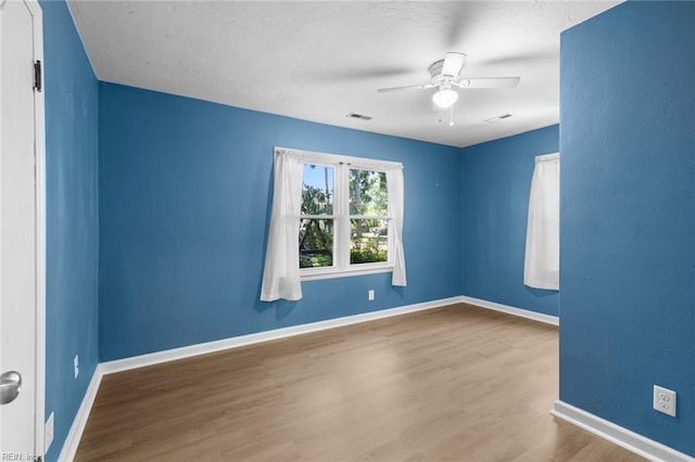 1204 Elder Ave, Chesapeake, VA 23325 - spare room featuring wood finished floors, ceiling fan, and baseboards