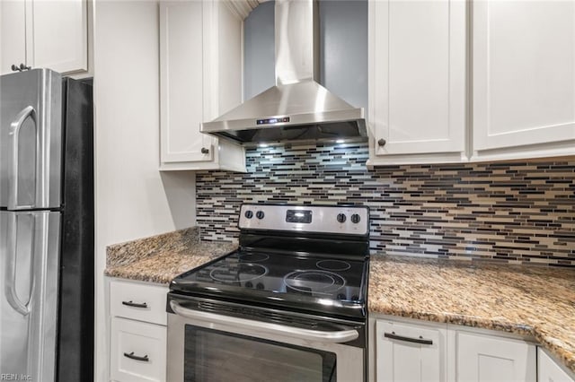 1204 Elder Ave, Chesapeake, VA 23325 - kitchen featuring wall chimney exhaust hood, appliances with stainless steel finishes, white cabinets, tasteful backsplash, and light stone countertops