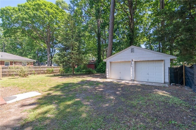 1204 Elder Ave, Chesapeake, VA 23325 - view of yard featuring an outbuilding and a detached garage