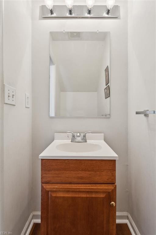 59 Terri Sue Ct, Hampton, VA 23666 - bathroom featuring vanity, baseboards, and wood finished floors