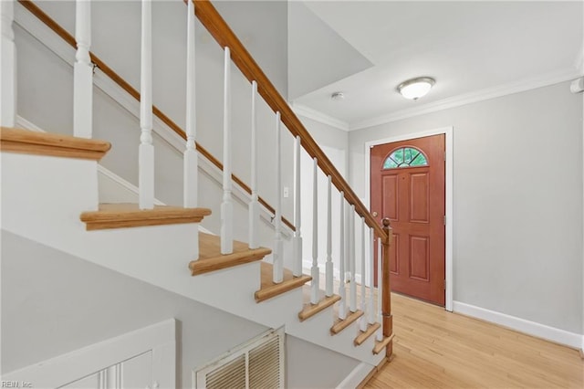4328 Thoroughgood Dr, Virginia Beach, VA 23455 - entryway with crown molding, baseboards, stairs, and light wood-style floors