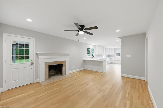 4328 Thoroughgood Dr, Virginia Beach, VA 23455 - unfurnished living room featuring light wood-type flooring, ceiling fan, a fireplace, recessed lighting, and baseboards