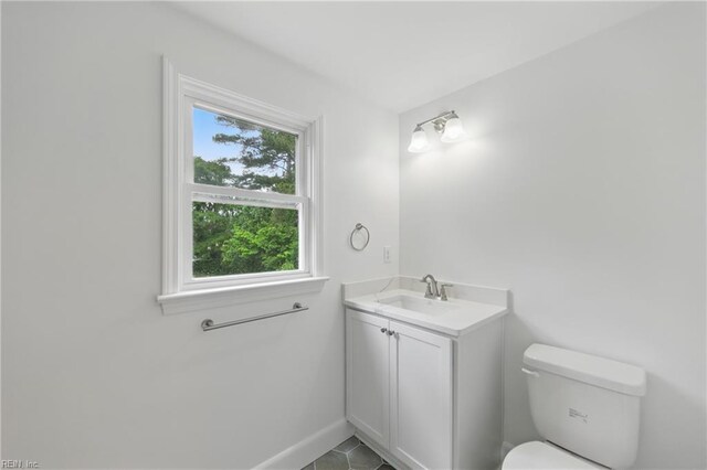 4328 Thoroughgood Dr, Virginia Beach, VA 23455 - half bathroom featuring toilet, vanity, baseboards, and tile patterned flooring