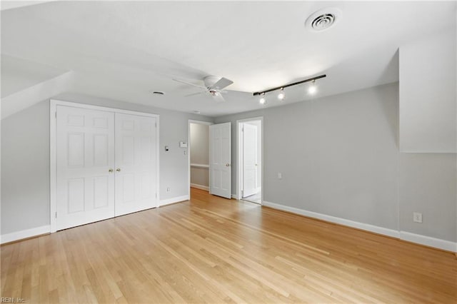 4328 Thoroughgood Dr, Virginia Beach, VA 23455 - unfurnished bedroom with light wood finished floors, baseboards, ceiling fan, and a closet