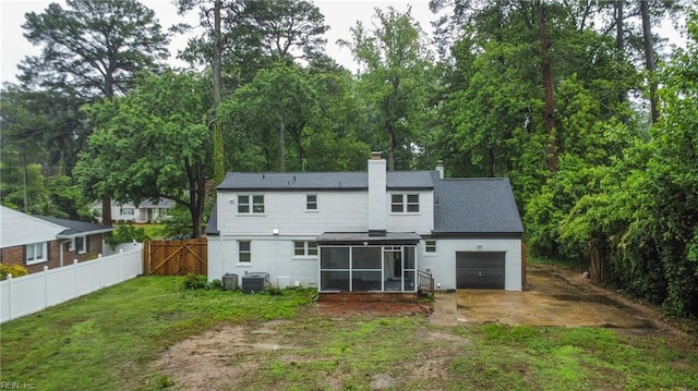 4328 Thoroughgood Dr, Virginia Beach, VA 23455 - rear view of property featuring a sunroom, a garage, driveway, a chimney, and cooling unit