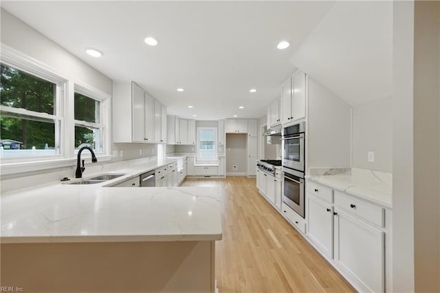 4328 Thoroughgood Dr, Virginia Beach, VA 23455 - kitchen featuring a sink, appliances with stainless steel finishes, under cabinet range hood, light stone counters, and recessed lighting
