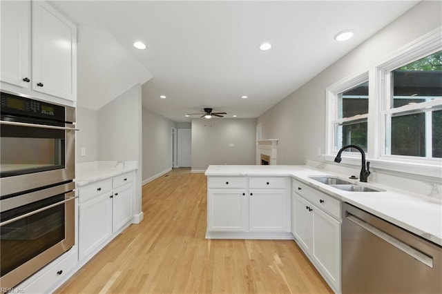4328 Thoroughgood Dr, Virginia Beach, VA 23455 - kitchen featuring stainless steel appliances, a sink, white cabinets, and recessed lighting