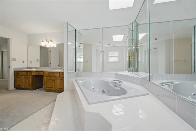 2520 Cantwell Rd, Virginia Beach, VA 23453 - bathroom with a skylight, vanity, a jetted tub, tile patterned floors, and a shower stall