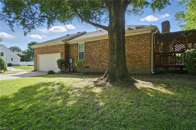 2520 Cantwell Rd, Virginia Beach, VA 23453 - view of home's exterior with a garage, a chimney, a yard, driveway, and brick siding
