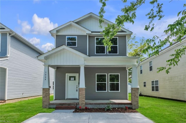 308 N Division St Unit B, Suffolk, VA 23434 - craftsman-style home with covered porch, board and batten siding, and a front lawn