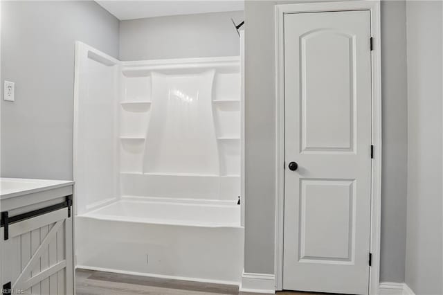 6428 Hudson Ave, Norfolk, VA 23502 - full bath featuring wood finished floors, vanity, and tub / shower combination