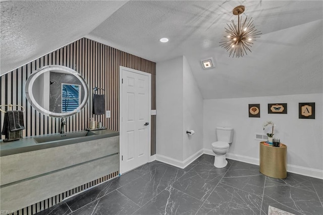30 W Southampton Ave, Hampton, VA 23669 - bathroom with lofted ceiling, a textured ceiling, baseboards, marble finish flooring, and toilet