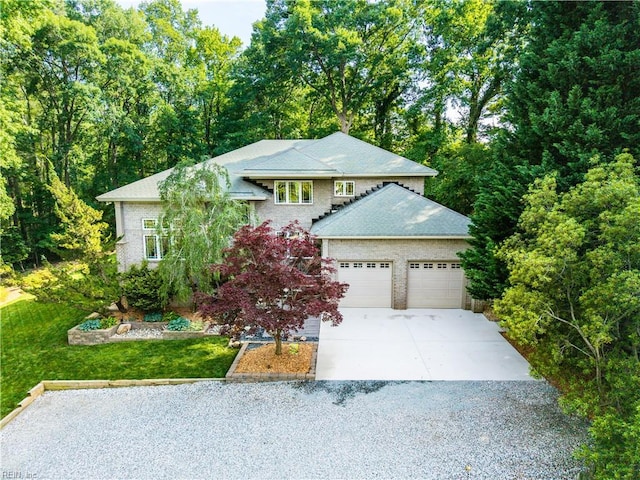 1301 Hawaiian Dr, Virginia Beach, VA 23451 - view of front of property featuring driveway, an attached garage, and a front yard