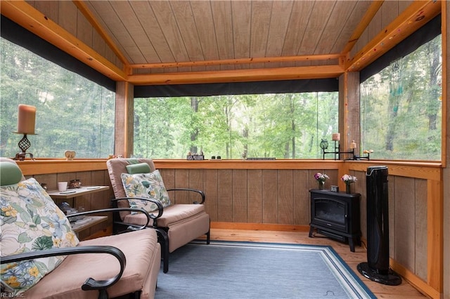 1301 Hawaiian Dr, Virginia Beach, VA 23451 - sunroom / solarium featuring a wood stove, wood ceiling, wood finished floors, and wooden walls