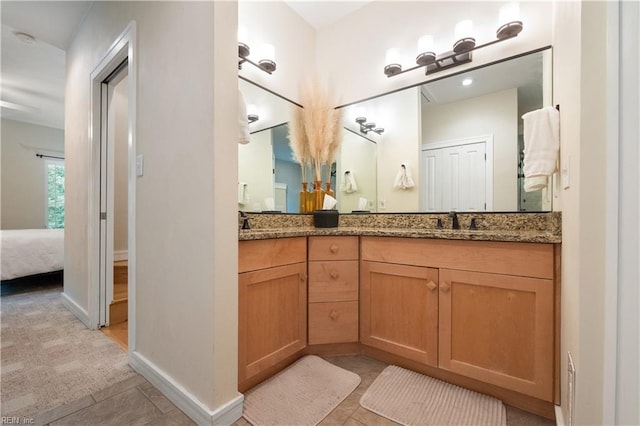 1301 Hawaiian Dr, Virginia Beach, VA 23451 - ensuite bathroom with double vanity, tile patterned flooring, and baseboards