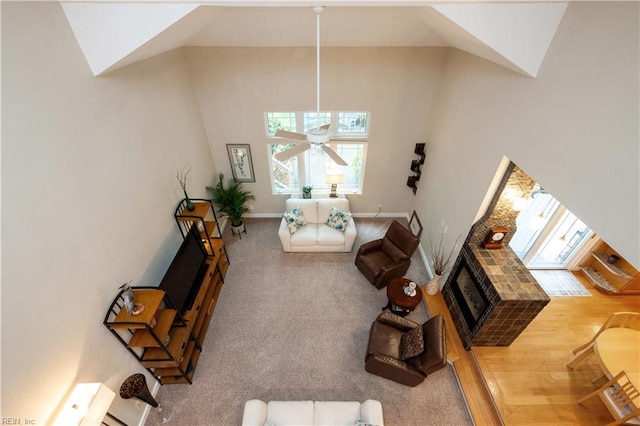 1301 Hawaiian Dr, Virginia Beach, VA 23451 - living area featuring healthy amount of natural light, baseboards, a ceiling fan, a fireplace, and high vaulted ceiling