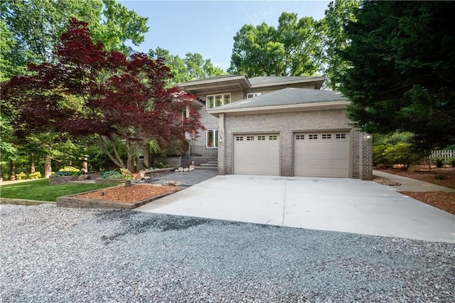 1301 Hawaiian Dr, Virginia Beach, VA 23451 - view of front of home with concrete driveway, an attached garage, and brick siding