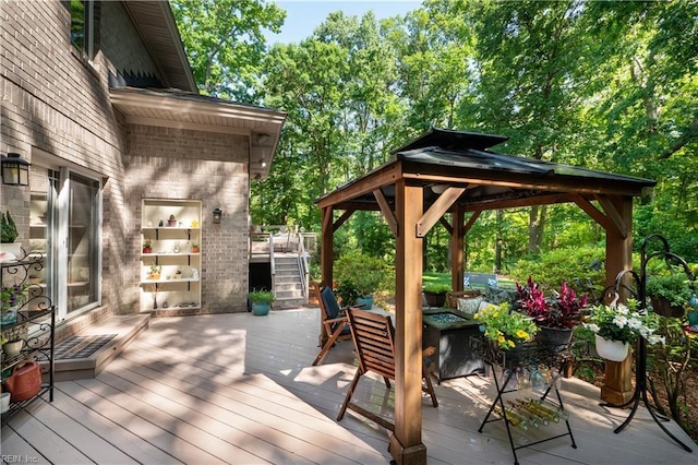 1301 Hawaiian Dr, Virginia Beach, VA 23451 - deck with a gazebo, a fire pit, stairway, and view of wooded area