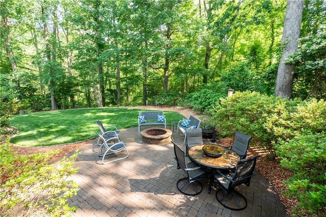 1301 Hawaiian Dr, Virginia Beach, VA 23451 - view of patio / terrace with an outdoor fire pit and a view of trees