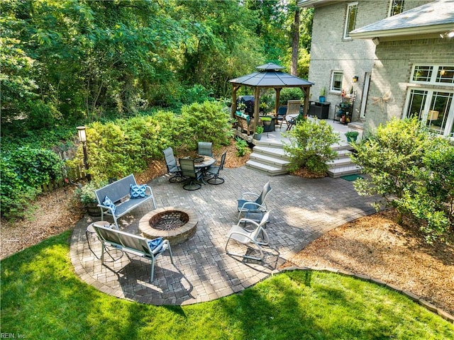 1301 Hawaiian Dr, Virginia Beach, VA 23451 - view of yard with an outdoor fire pit, a gazebo, a wooden deck, and a patio