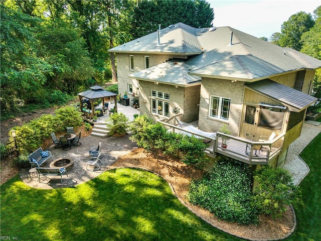 1301 Hawaiian Dr, Virginia Beach, VA 23451 - rear view of house with a fire pit, a gazebo, a patio area, and a lawn