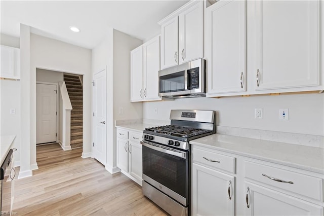 1400 Acadian Dr Unit A, Suffolk, VA 23434 - kitchen with appliances with stainless steel finishes, white cabinetry, light wood finished floors, recessed lighting, and baseboards
