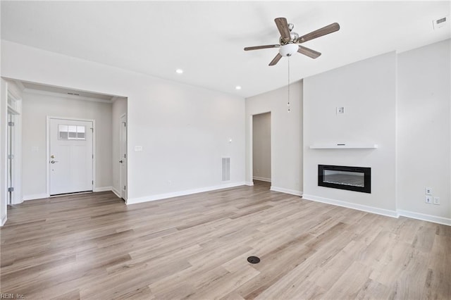 1400 Acadian Dr Unit A, Suffolk, VA 23434 - unfurnished living room with ceiling fan, baseboards, a glass covered fireplace, light wood-style floors, and recessed lighting