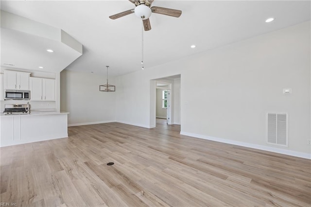 1400 Acadian Dr Unit A, Suffolk, VA 23434 - unfurnished living room featuring a ceiling fan, baseboards, recessed lighting, and light wood finished floors