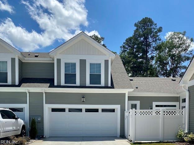 1400 Acadian Dr Unit A, Suffolk, VA 23434 - view of front of house featuring driveway, an attached garage, and a shingled roof