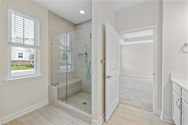1400 Acadian Dr Unit A, Suffolk, VA 23434 - bathroom featuring vanity, baseboards, a stall shower, plenty of natural light, and recessed lighting