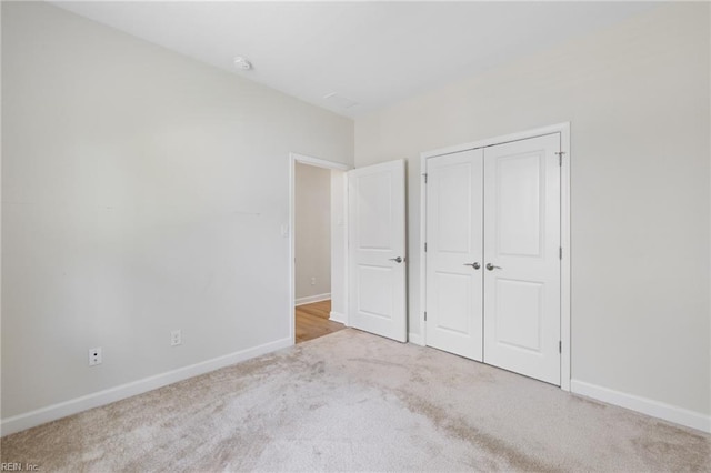 1400 Acadian Dr Unit A, Suffolk, VA 23434 - unfurnished bedroom with carpet, baseboards, and a closet
