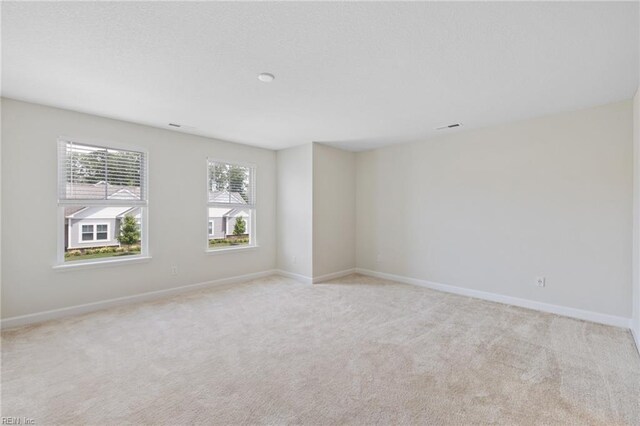 1400 Acadian Dr Unit A, Suffolk, VA 23434 - unfurnished room with baseboards and light carpet