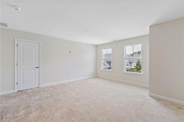 1400 Acadian Dr Unit A, Suffolk, VA 23434 - empty room with light colored carpet, baseboards, and a smoke detector