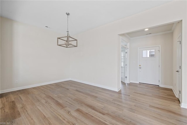 1400 Acadian Dr Unit A, Suffolk, VA 23434 - unfurnished dining area featuring a chandelier, light wood-style floors, baseboards, and crown molding