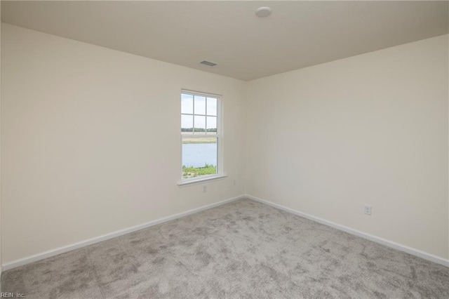 102 Corcoran Ln, Suffolk, VA 23434 - carpeted empty room featuring baseboards and a water view
