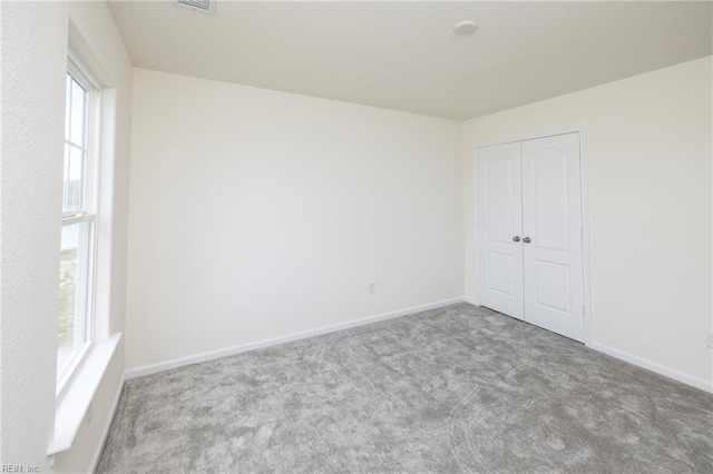 102 Corcoran Ln, Suffolk, VA 23434 - carpeted spare room with baseboards