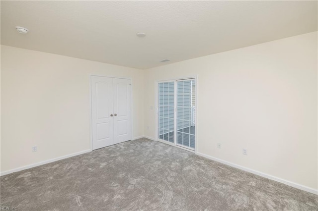 102 Corcoran Ln, Suffolk, VA 23434 - spare room featuring carpet floors, a smoke detector, and baseboards