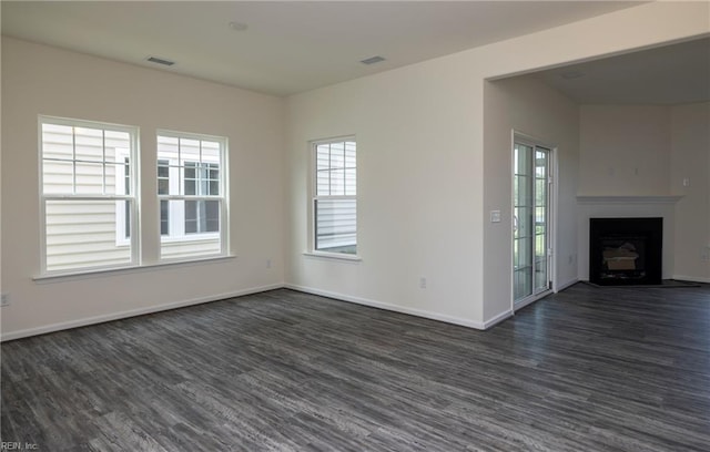 102 Corcoran Ln, Suffolk, VA 23434 - unfurnished living room with dark wood-style flooring, plenty of natural light, and baseboards