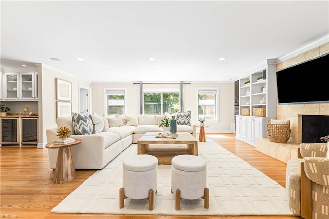 1825 N Alanton Dr, Virginia Beach, VA 23454 - living area featuring light wood-style flooring, crown molding, beverage cooler, recessed lighting, and baseboards
