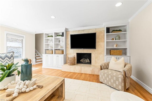 1825 N Alanton Dr, Virginia Beach, VA 23454 - living area featuring crown molding, wood finished floors, baseboards, built in shelves, and a fireplace