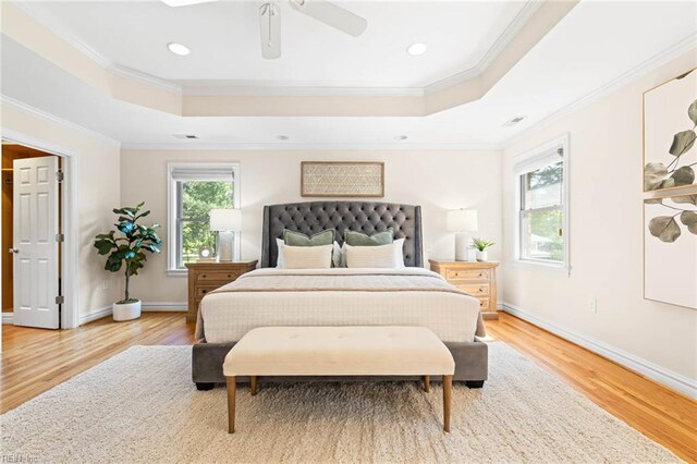 1825 N Alanton Dr, Virginia Beach, VA 23454 - bedroom with a tray ceiling, light wood-type flooring, ceiling fan, crown molding, and baseboards