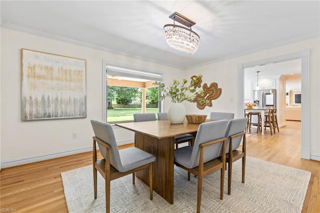 1825 N Alanton Dr, Virginia Beach, VA 23454 - dining room featuring ornamental molding, a chandelier, light wood finished floors, and baseboards