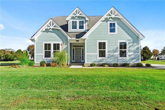 142 Quarter Horse Loop, Hertford, NC 27944 - view of front facade with a front lawn and roof with shingles