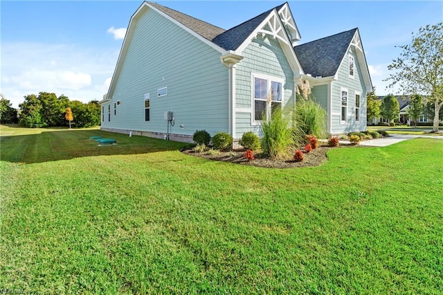 142 Quarter Horse Loop, Hertford, NC 27944 - view of property exterior featuring a lawn and roof with shingles