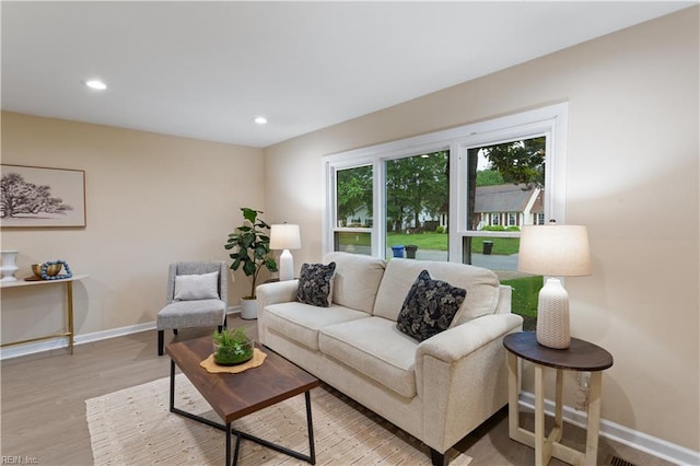 3408 Wakefield Dr, Portsmouth, VA 23703 - living area featuring baseboards, light wood finished floors, and recessed lighting