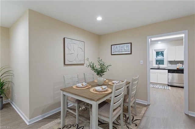 3408 Wakefield Dr, Portsmouth, VA 23703 - dining space featuring light wood-style floors, recessed lighting, and baseboards