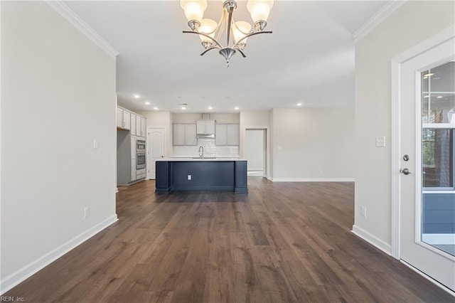 151 Highland Pony Dr, Hertford, NC 27944 - unfurnished living room featuring a chandelier, baseboards, dark wood-type flooring, ornamental molding, and recessed lighting